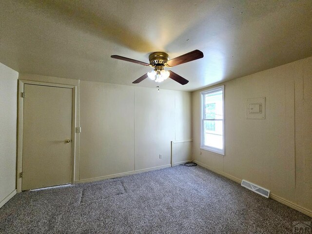 empty room featuring visible vents and carpet flooring