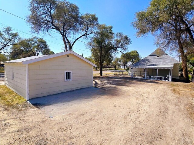 exterior space with dirt driveway