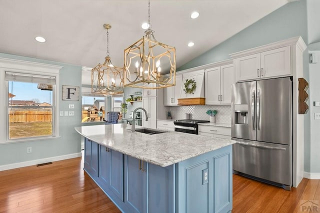 1153 E Kirkwood Dr, Pueblo, CO 81007 - kitchen featuring a sink, stainless steel fridge with ice dispenser, white cabinetry, electric range, and a notable chandelier