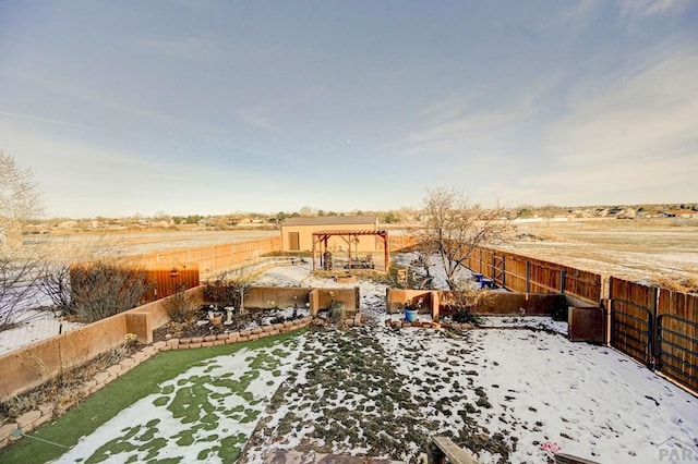 view of yard with a rural view and a fenced backyard