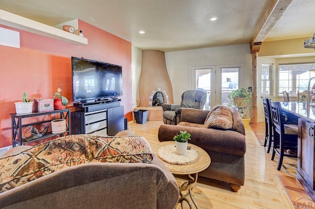 living area with recessed lighting and light wood-style floors