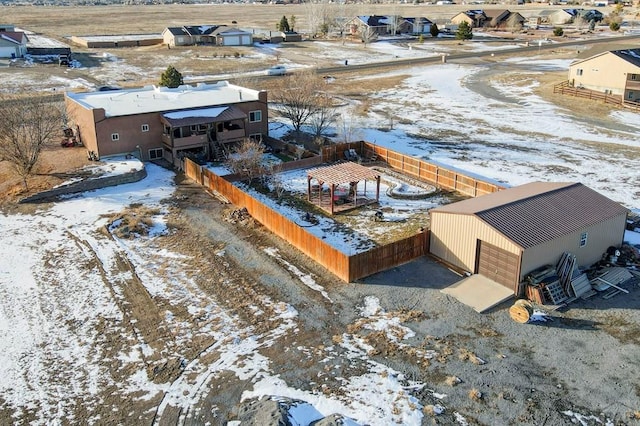 snowy aerial view featuring a residential view