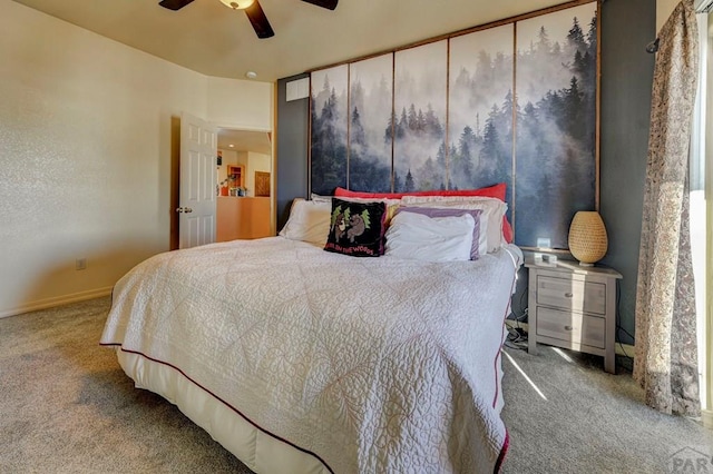 bedroom with ceiling fan, carpet flooring, and baseboards