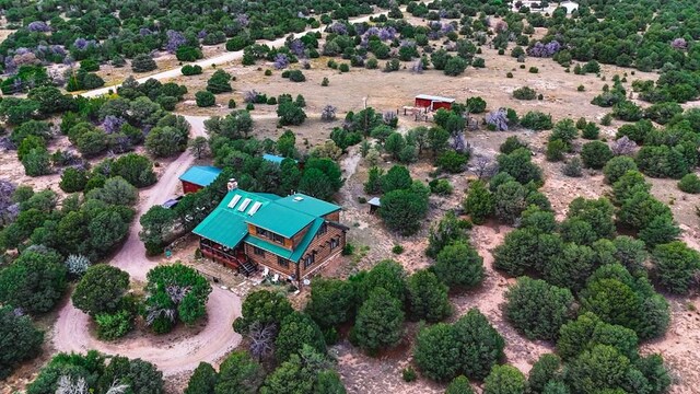 birds eye view of property featuring a rural view