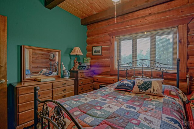 bedroom with log walls, wooden ceiling, and beam ceiling