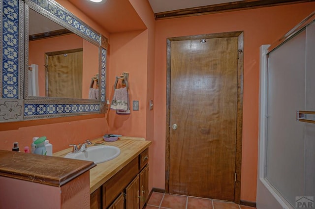 full bath with tile patterned flooring and vanity