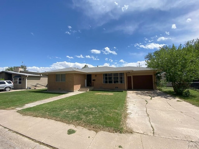 ranch-style house with concrete driveway, brick siding, an attached garage, and a front yard