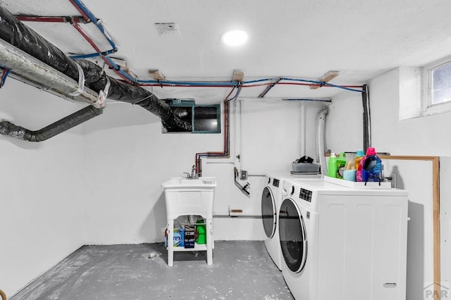 washroom with washer and dryer and laundry area