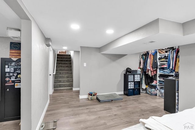 interior space featuring recessed lighting, visible vents, stairway, light wood-style flooring, and baseboards