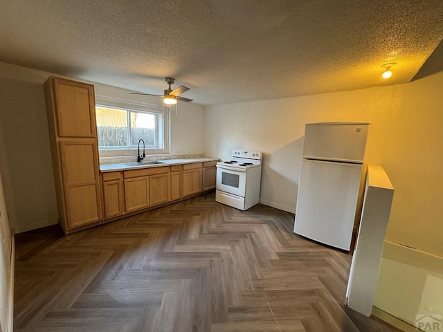 1718 E Abriendo Ave, Pueblo, CO 81004 - kitchen featuring white appliances, a sink, light countertops, a textured ceiling, and ceiling fan