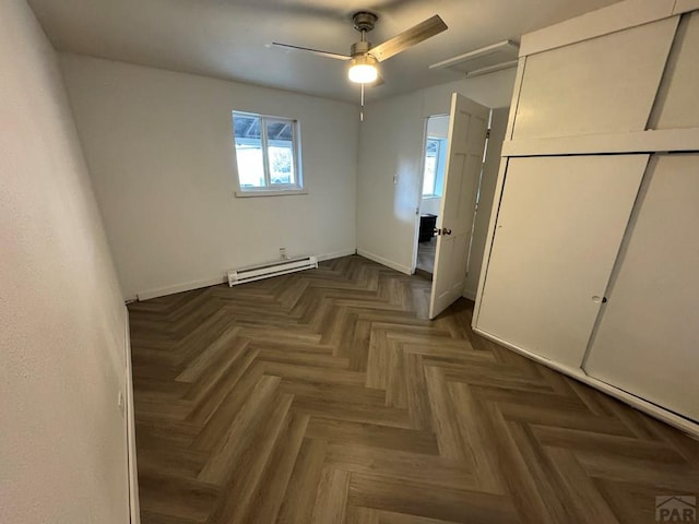 1718 E Abriendo Ave, Pueblo, CO 81004 - unfurnished bedroom with baseboard heating, baseboards, ceiling fan, and a closet
