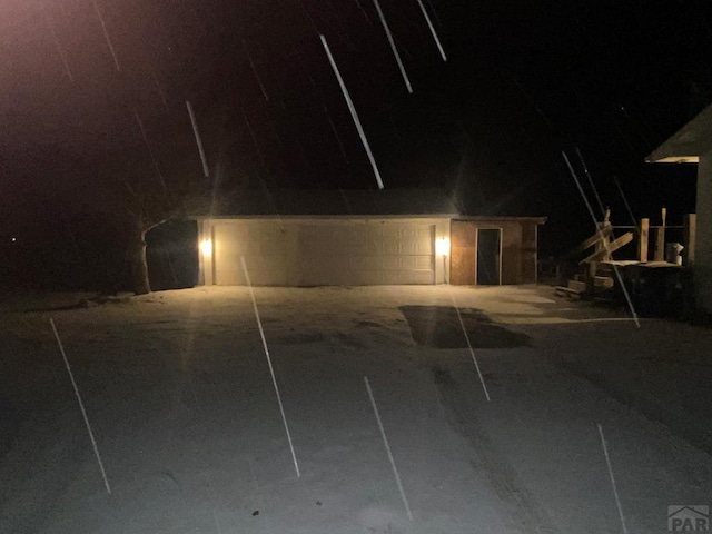 view of garage at night