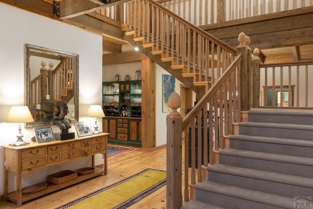 stairs featuring wood finished floors