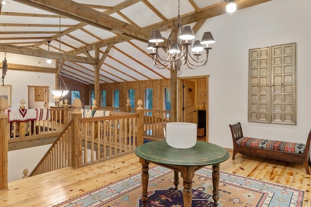 interior space featuring high vaulted ceiling, wood finished floors, beam ceiling, and a notable chandelier