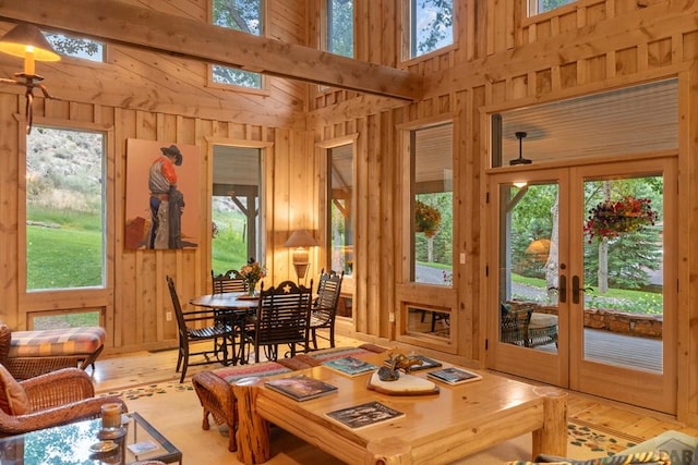 sunroom / solarium featuring french doors and plenty of natural light