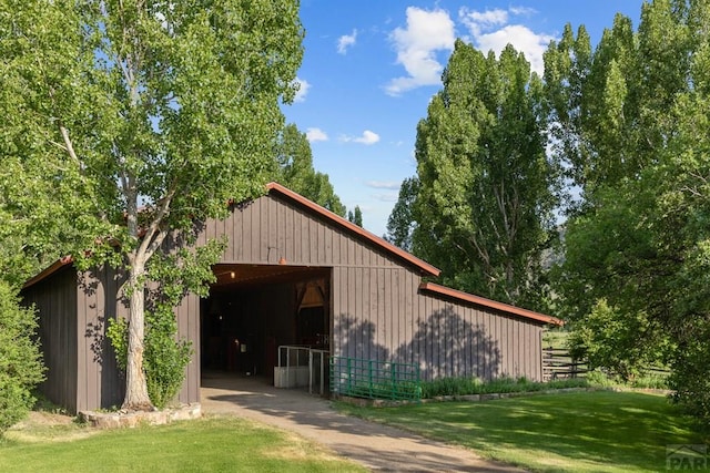 view of pole building with a yard