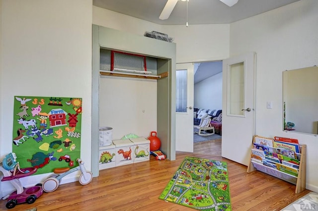 playroom with ceiling fan and wood finished floors