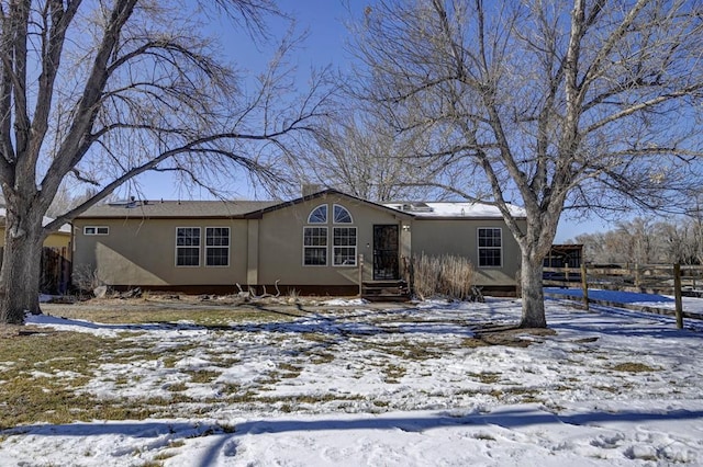 manufactured / mobile home featuring stucco siding