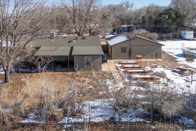view of snow covered property