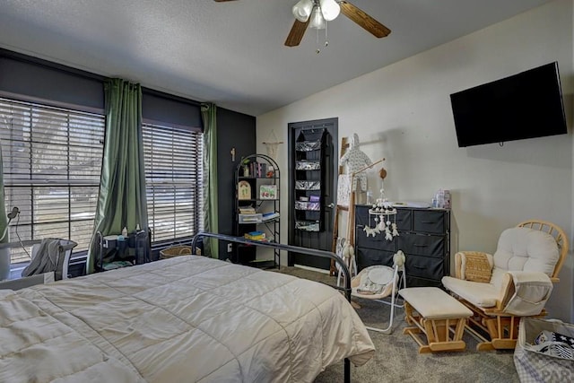 carpeted bedroom with lofted ceiling and ceiling fan