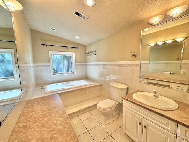 bathroom featuring toilet, tile patterned flooring, vaulted ceiling, a textured ceiling, and a bath