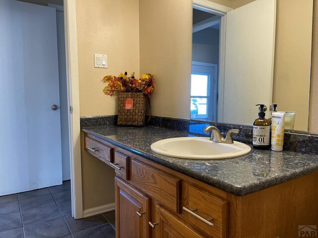 bathroom featuring tile patterned floors and vanity