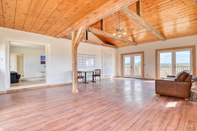 unfurnished living room featuring ceiling fan, french doors, wood finished floors, and wood ceiling