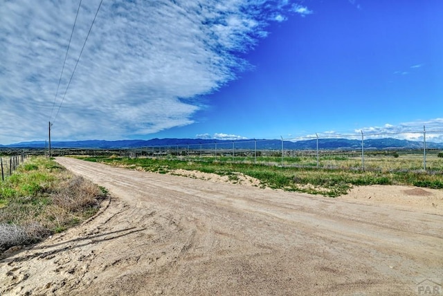 view of road with a mountain view and a rural view