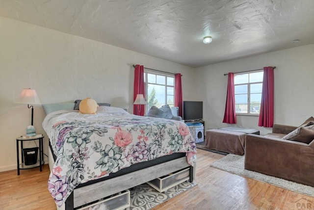 bedroom featuring wood finished floors