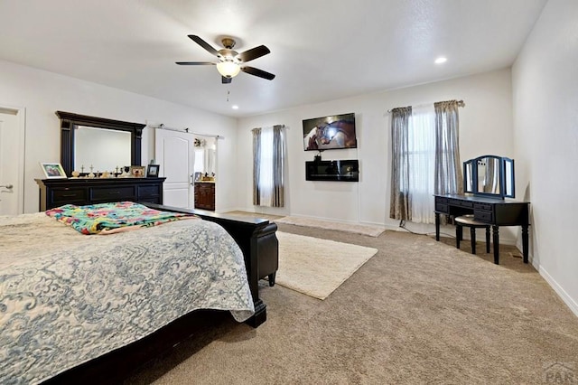 carpeted bedroom with ensuite bathroom, baseboards, recessed lighting, and ceiling fan