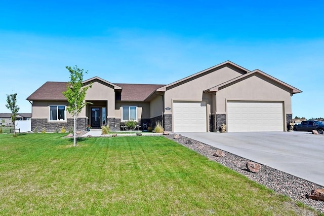 single story home with stucco siding, driveway, stone siding, a front yard, and a garage