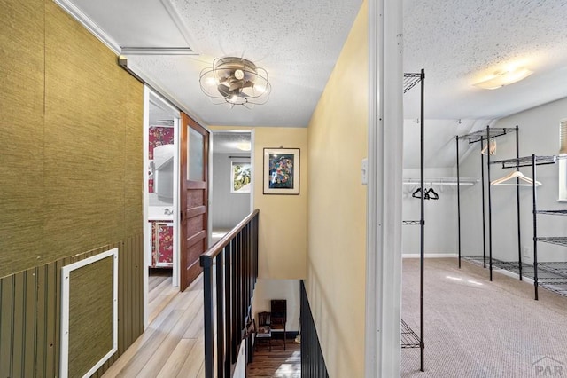 hallway featuring a textured ceiling