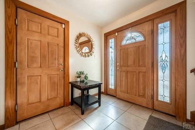 entryway with light tile patterned flooring