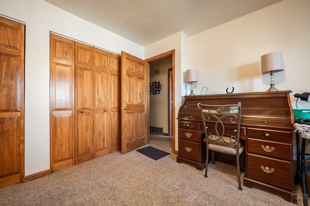 interior space featuring light carpet, baseboards, and visible vents