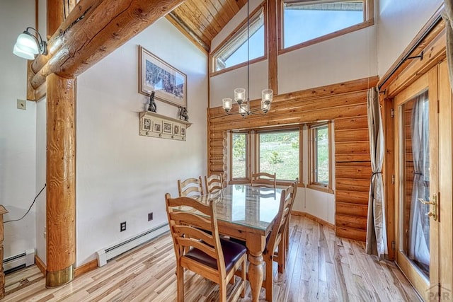 dining area with high vaulted ceiling, a baseboard radiator, log walls, and light wood-style flooring