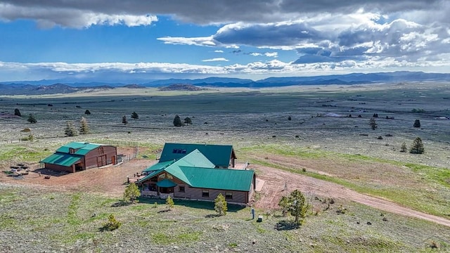 birds eye view of property with a rural view and a mountain view