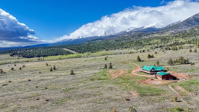 mountain view featuring a rural view