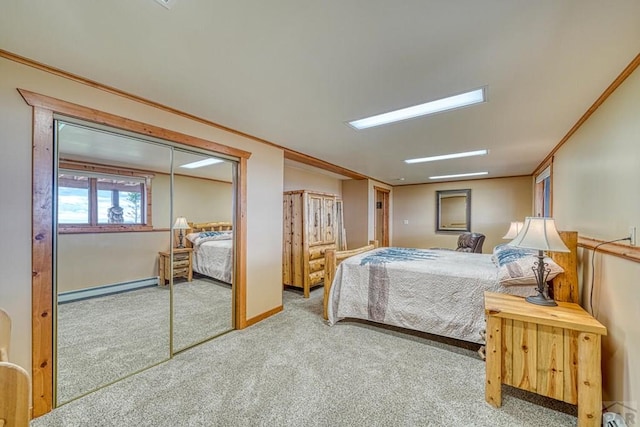 carpeted bedroom featuring baseboards, ornamental molding, and baseboard heating