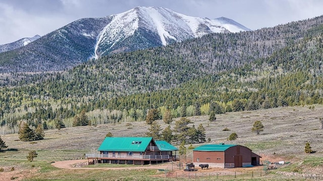 property view of mountains with a rural view and a forest view