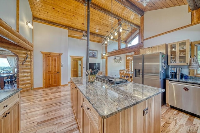 kitchen with glass insert cabinets, a center island, wooden ceiling, and high vaulted ceiling