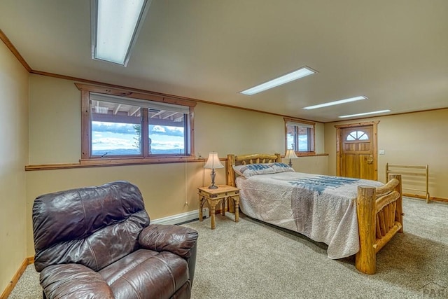 bedroom with carpet, ornamental molding, baseboard heating, and baseboards