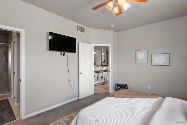 bedroom featuring light carpet, visible vents, baseboards, and light tile patterned flooring