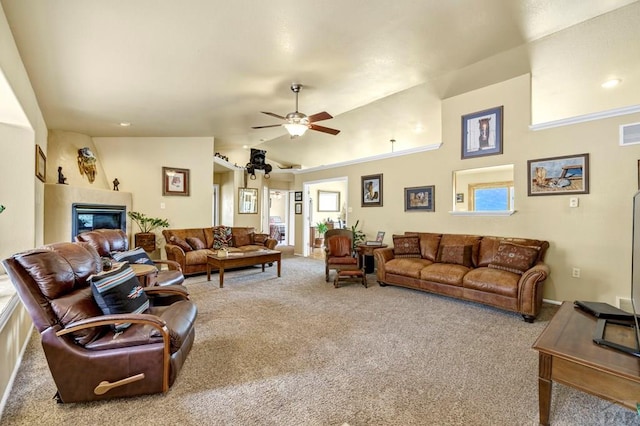 living room featuring light carpet, vaulted ceiling, visible vents, and ceiling fan