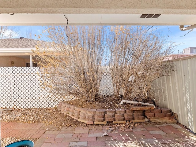 view of yard featuring a patio area and fence