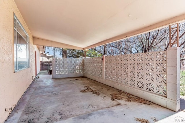 view of patio / terrace featuring fence