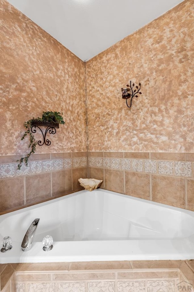 full bath with a bath