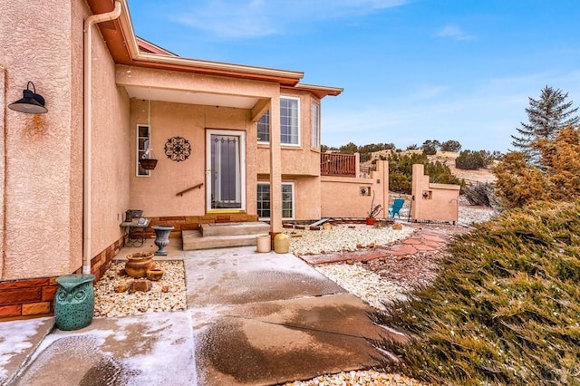 doorway to property with stucco siding