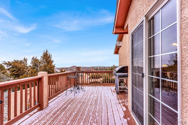 wooden deck with area for grilling