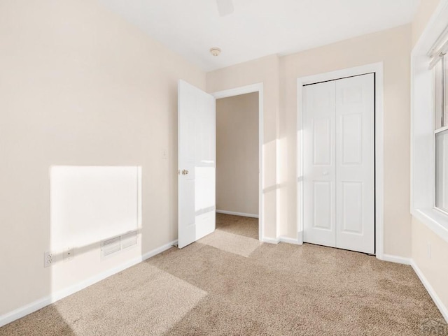 4400 Rawhide Rd Unit 132, Pueblo, CO 81008 - unfurnished bedroom featuring carpet, visible vents, and baseboards