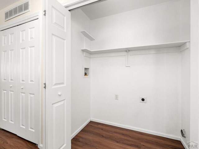 4400 Rawhide Rd Unit 132, Pueblo, CO 81008 - laundry area with dark wood finished floors, laundry area, visible vents, hookup for an electric dryer, and baseboards